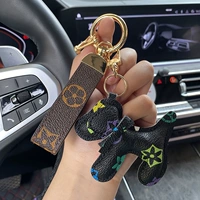 Золотая кожаная веревка+черный щенок