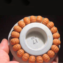 Fine brushed grinding plate local tyrant monkey head gold silk walnut hand string play round beads Buddha beads carving men and women