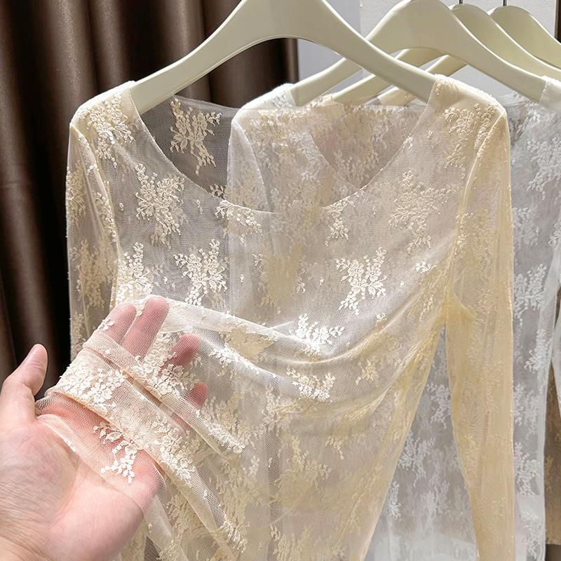 春と秋の女性のための透明なチュールボトムシャツ、高級中空ローラウンドネックメッシュレースシャツ、セクシーなインナートップ