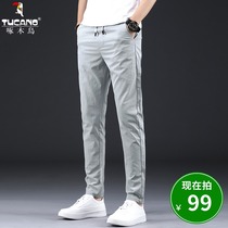 Woodpecker summer ice silk casual pants men Korean version of trend small feet trousers men Joker slim slim pants tide