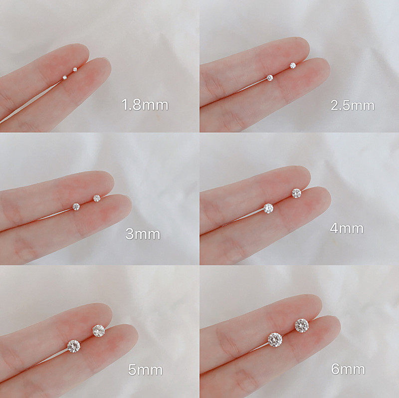 Black and white splicing ear pin Mini raising ear hole four paws water drill small ear needle stick 100 hitch male and female earbone nail Han