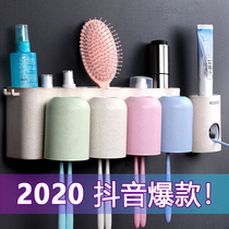 Toothbrush holder Wall-suction pressing wall-mounted toothpaste squeezer Automatic punch-free toilet extruder set