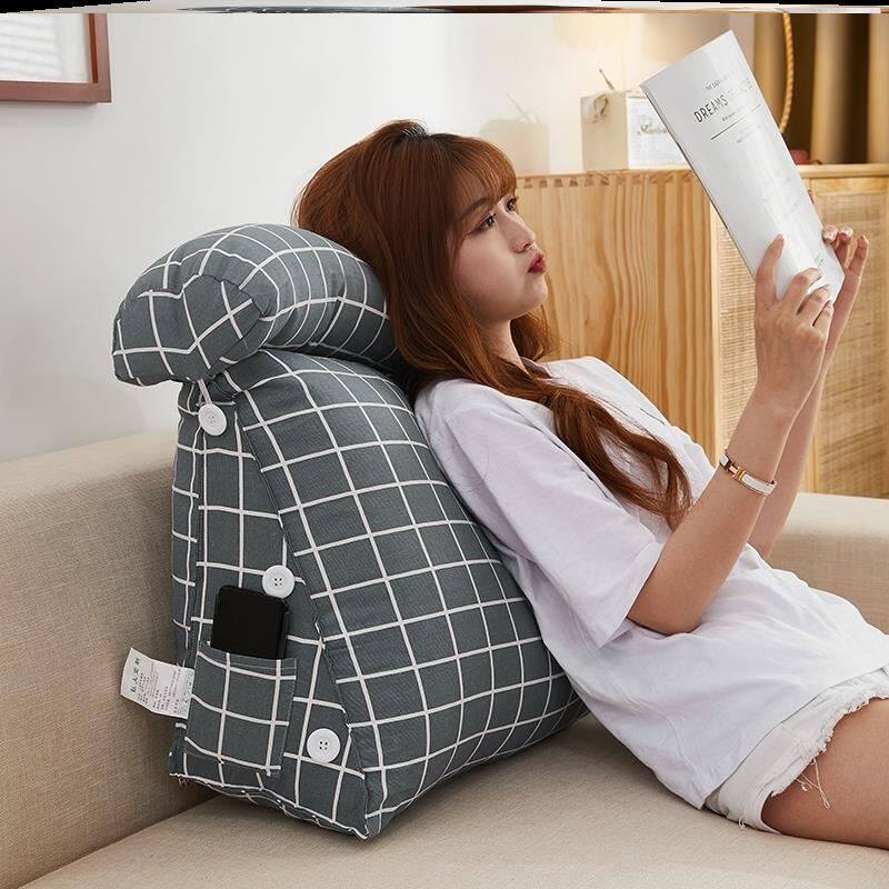 The old man sits and sleeps on the back cushion to support the artifact patient half-lying on the bed and half-recumbent special nursing lumbar ridge