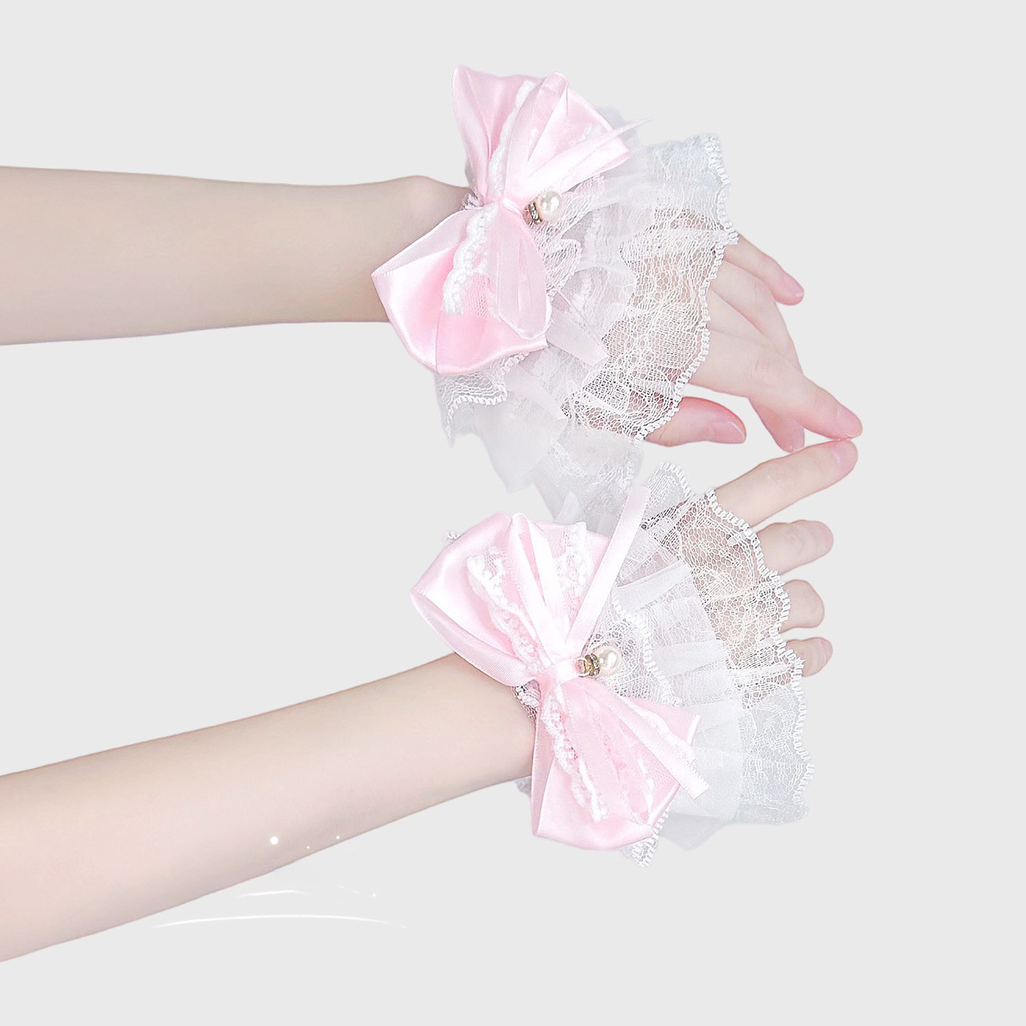 Pink lace trimmed sleeves, pearl bow, sweet and girly JK style wristbands, fairy-like decorations.