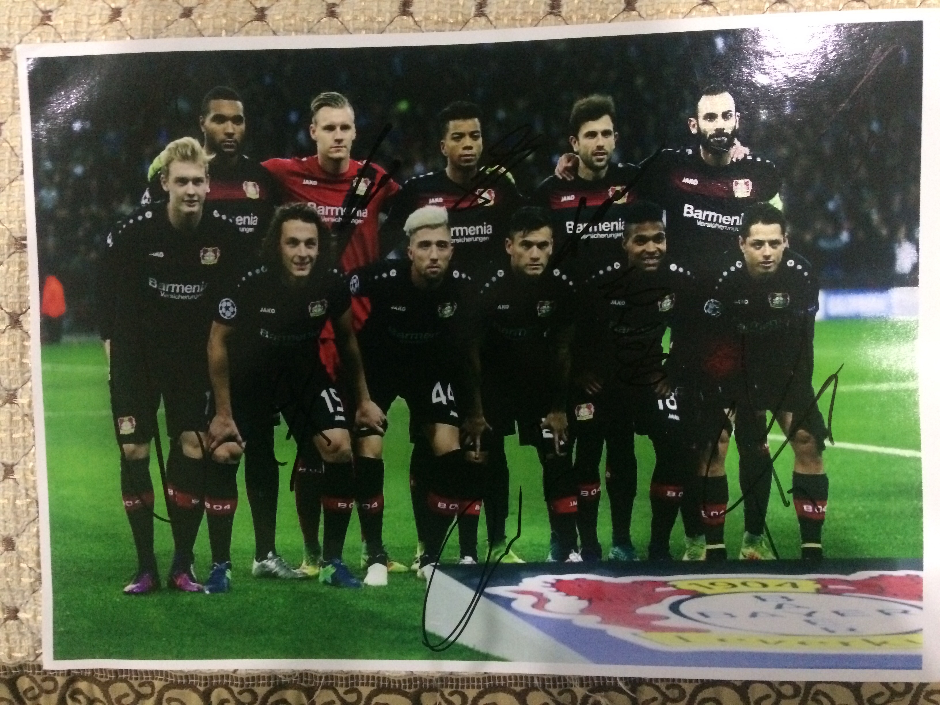 Autographed photos of Leverkusen's starting lineup, including Brant Kampl and others