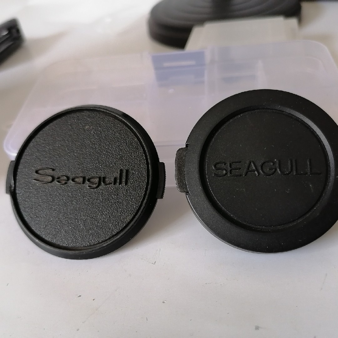 A Seagull original 52mm lens cap (not too smooth) is ok as a supporting accessory