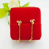 Золотые серьги с бантиком