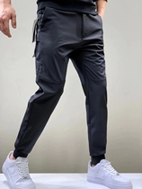 Soft shell outdoor King niao same men men mountaineering windproof waterproof tie mouth plus velvet casual trousers 7259