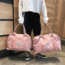 Short-distance travel bag female portable storage luggage bag Net Red large capacity waterproof light outside business luggage bag male tide