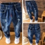 Quần jeans bé trai mùa xuân hè 2018 cho bé trai thường xuyên thả lỏng quần mỏng phần trẻ em mùa thu quần bé quần áo be gái 10 tuổi