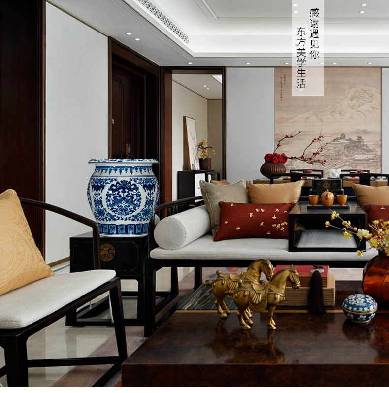 Jingdezhen ceramics by hand draw Chinese blue and white porcelain vase sitting room adornment is placed on the calligraphy and painting scroll cylinder