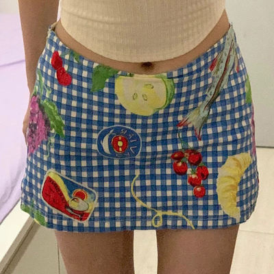 WEEKEEP's distinctive fruit and floral checkered print skirt is a low-waisted, slimming short skirt