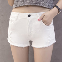 2019 new Korean version of the low waist hole raw edge white denim shorts womens summer slim tight thin stretch hot pants