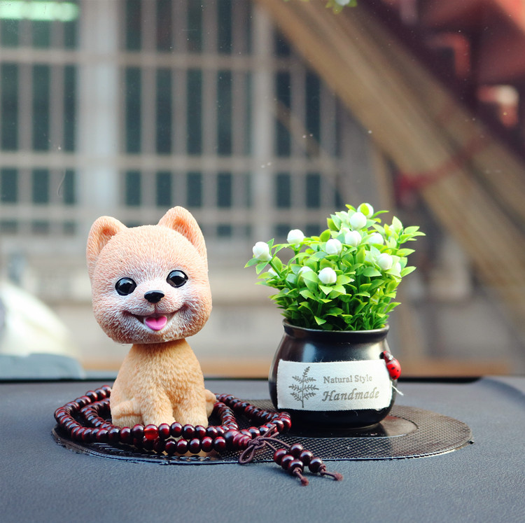 Đồ trang trí nội thất xe hơi dễ thương cung cấp xe trung tâm sáng tạo giao diện điều khiển lắc đầu chó nam và phụ nữ xe hơi trang trí xe oto