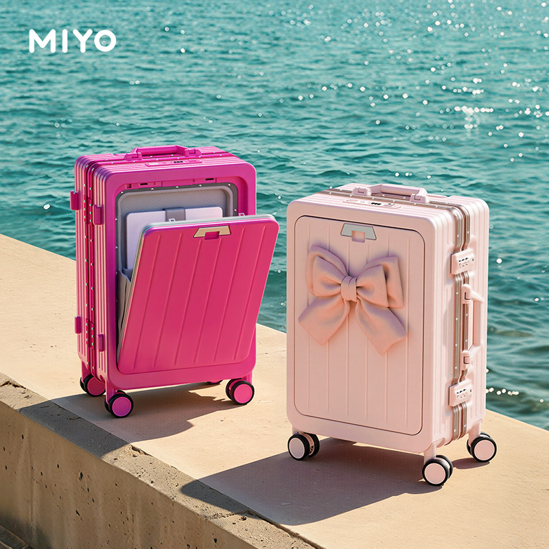 MIYO's new 20-inch front-opening carry-on suitcase in cherry blossom pink with an aluminum frame and combination lock.
