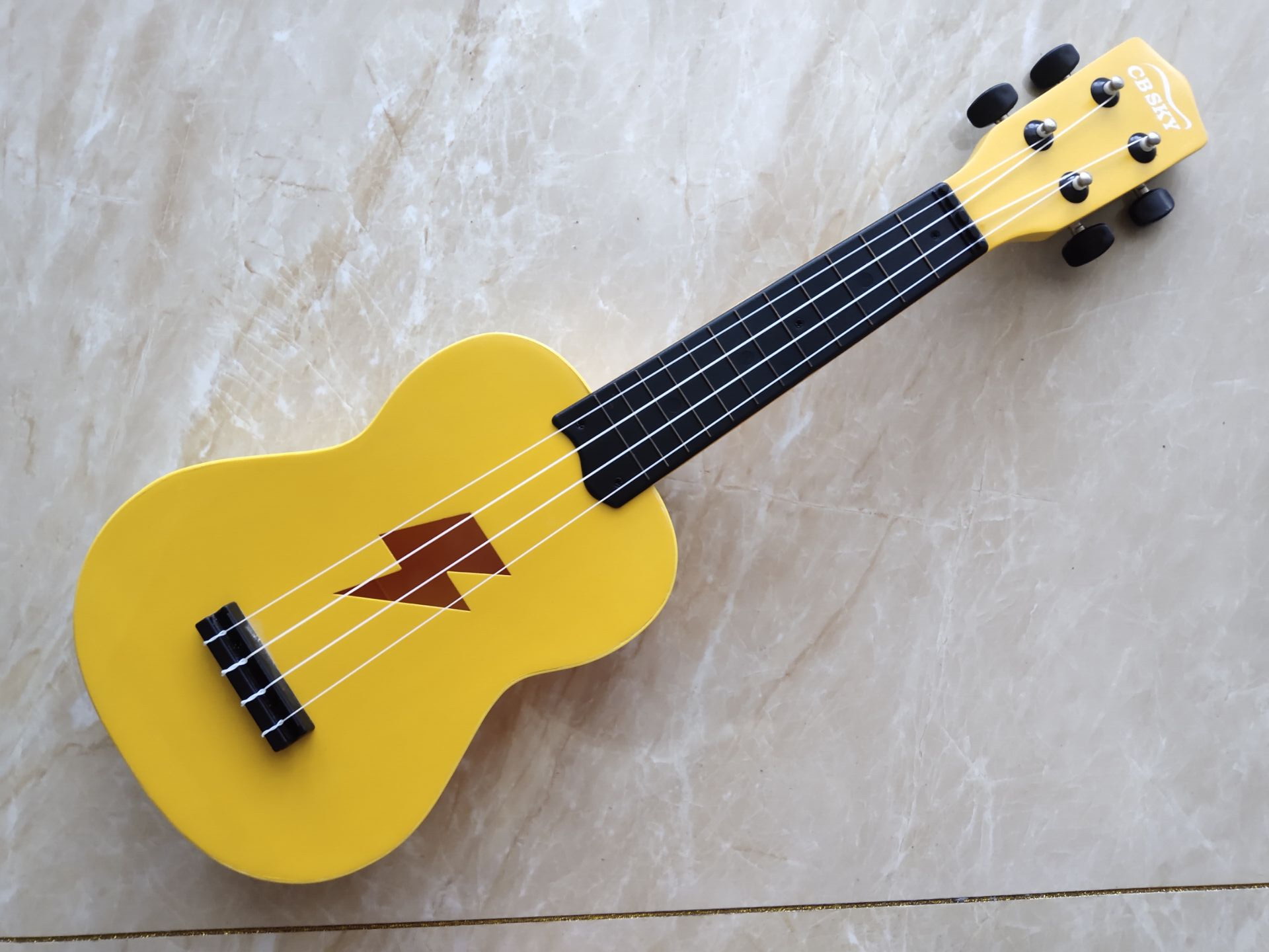 Export original single children's wooden 4-string ukulele send book and hold baby bag can be played for beginners