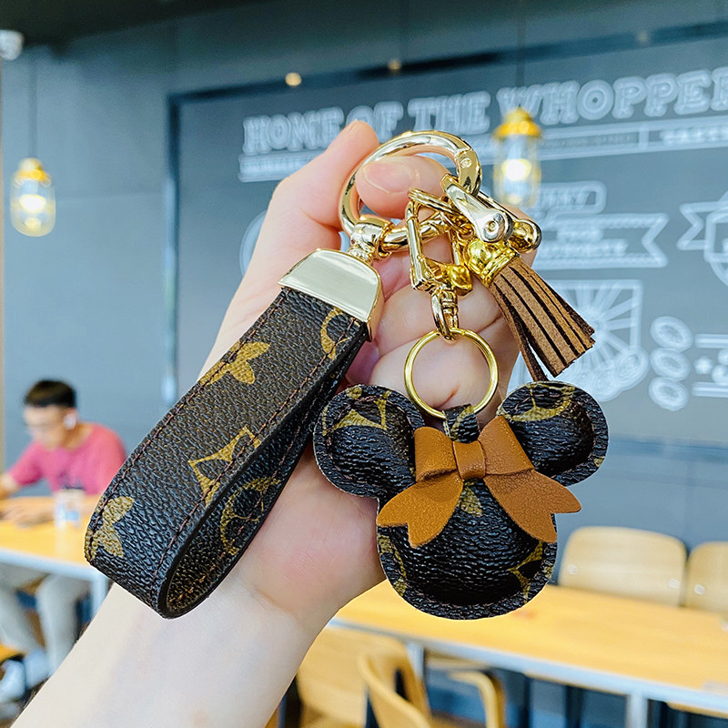 High-grade leather car keychain creative Mickey hair ball key chain European and American personality bag pendant gift for women