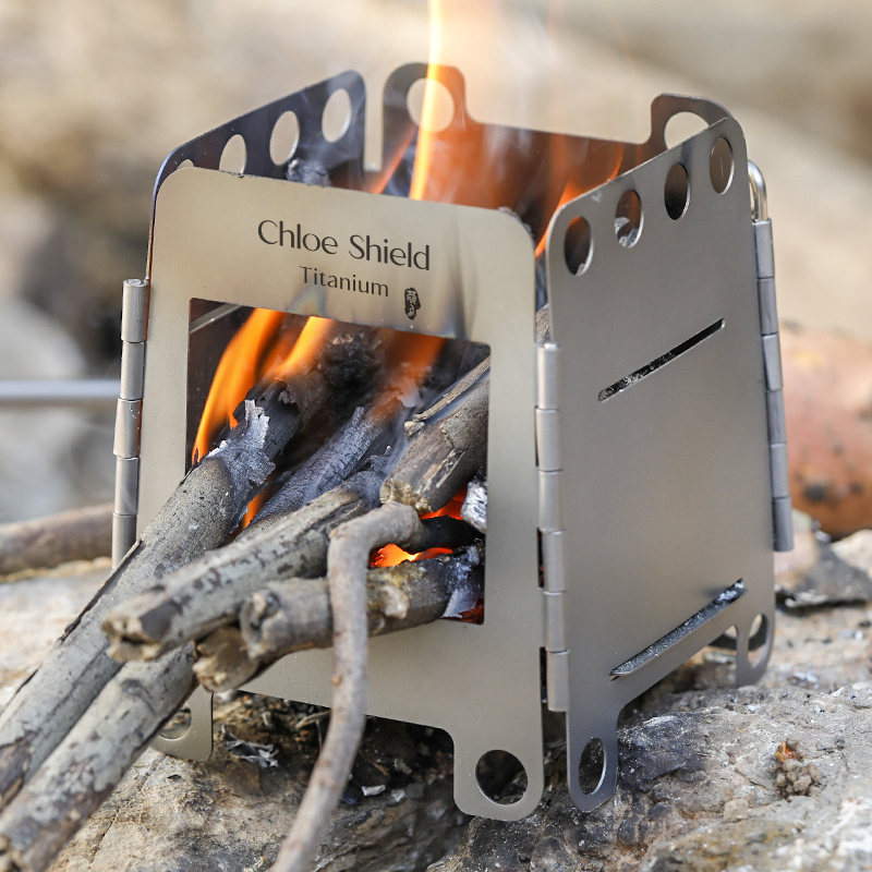 Cog shield outdoor camping pure titanium firewood fire stove heating credit card folding dual-use alcohol stove Mengfire riding portable stove