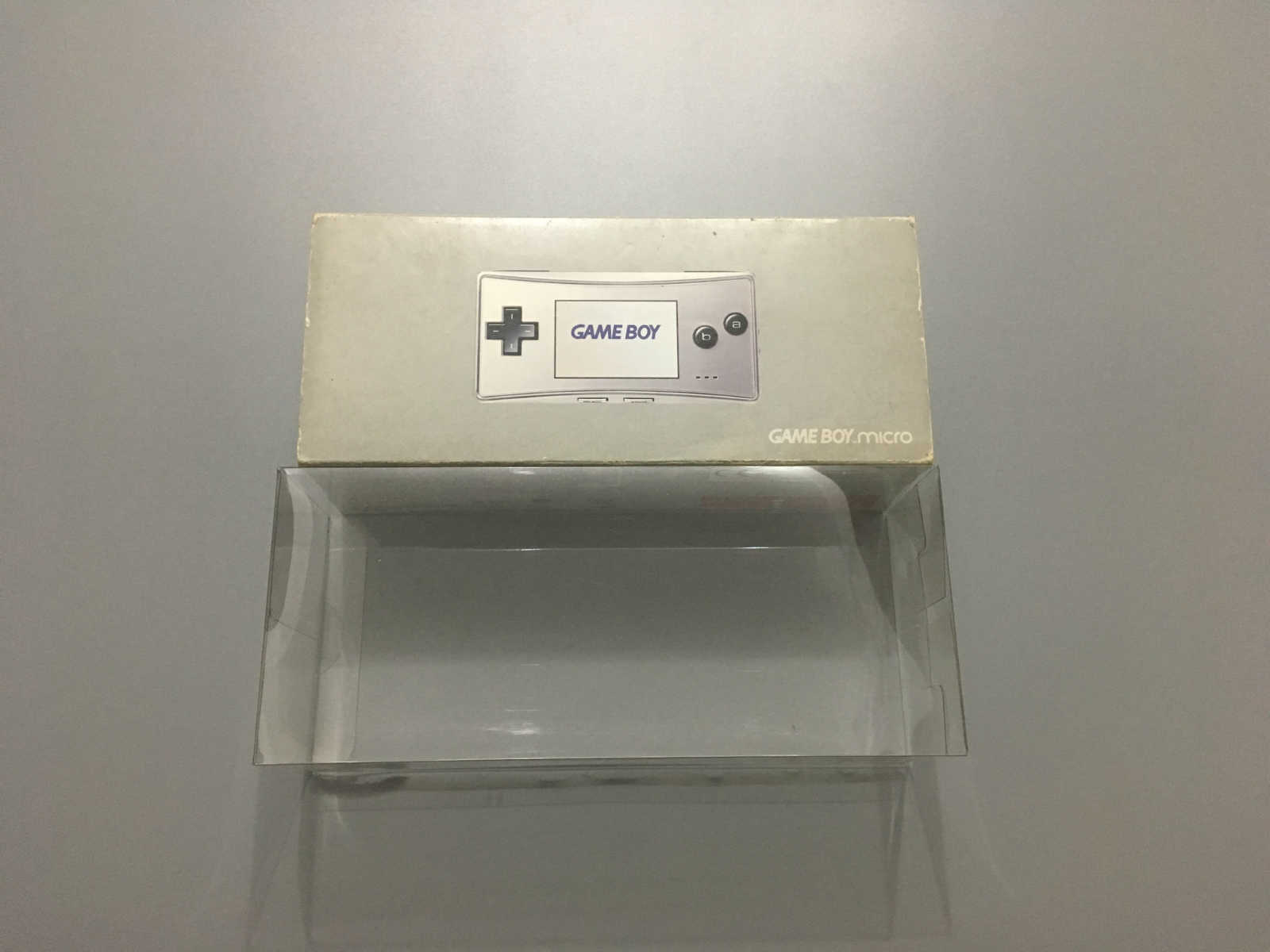 Nintendo gbm European version of transparent box protective sleeve display case containing box protection box collection box