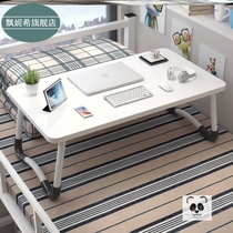 The desk sitting on the bed folding the small table ins the carpet floating on the windowsill Kang for the bed.
