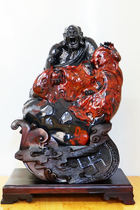 Guilin chicken blood jade mountain pit jade pretty ornaments black background and red finely carved ornaments five blessing arhats lion roaring arhats