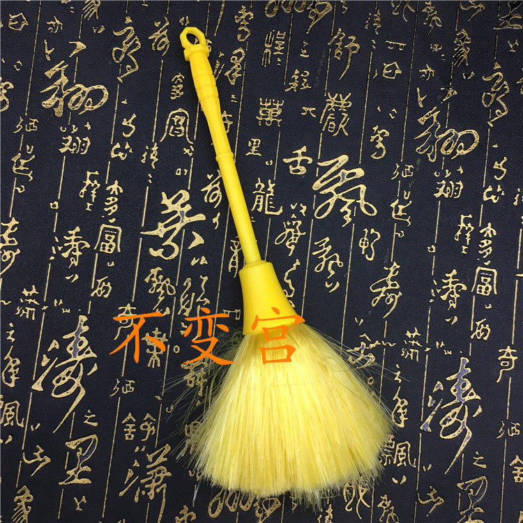 Special cleaning utensils for Buddha statues are used to sweep away dust