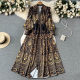 2023 spring new holiday style V-neck puff sleeve printed dress women's French retro big swing over the knee long skirt