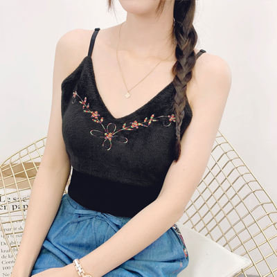 A off-the-shoulder mini vest with ethnic style embroidery, fleece and thickened base, paired with a black short halter top, is sexy and fashionable for women in winter