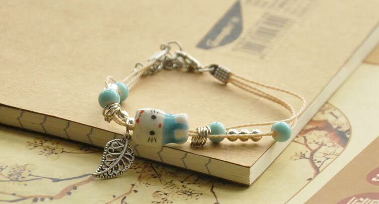 Handmade sáng tạo đồ trang sức nhỏ Jingdezhen gốm sứ dễ thương mèo vòng tay người yêu đồ trang sức unisex bện dây điều chỉnh vòng tay cao su