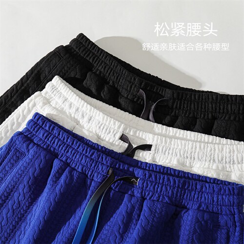 2023夏季新款贴标华夫格排扣开叉男宽松休闲五分短裤DK28626-P45图片