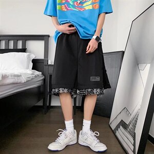 男春季潮流时尚假两件休闲短裤A707P20,黑色马甲搭配什么颜色耳环图片