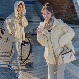 2021冬季新款韩版宽松中长款休闲连帽羽绒服女配挂件小兔子图片