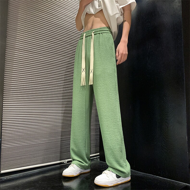 褶皱肌理裤子男生秋季简约潮牌阔腿直筒宽松大码垂感果绿休闲长裤图片
