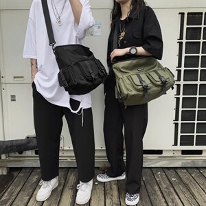 0534新款潮纯色港风多功能男士斜挎包情侣背包防水复古单肩包图片