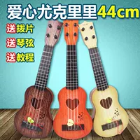 Đàn guitar nhỏ của trẻ em, đó là đồ chơi có thể chơi mô phỏng đàn ukulele vừa mới bắt đầu chơi nhạc cụ để gửi picks đồ chơi