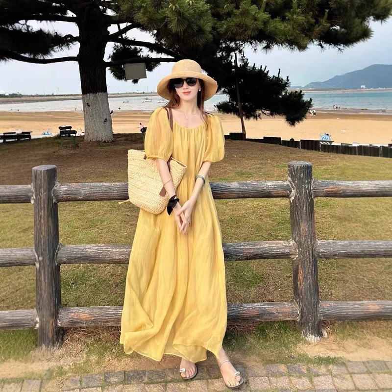 Designed with a Sense of Style and Ambiance, the Backless Yellow Dress for Women Is a Lazy, Loose-Fitting, Slimming, and Ethereal Long Dress for Seaside Vacations