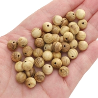 Молочное дерево 8мм, диаметр отверстия около 1мм, в упаковке 50шт (около 10г)