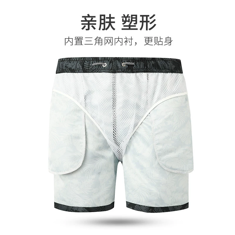 Quần đi biển nam lót tam giác rộng rãi và nhanh khô Quần năm điểm có thể tung tăng trên bãi biển quần short cỡ lớn bơi lội quần short - Quần bãi biển