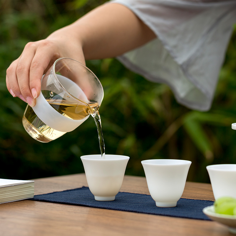 Don difference up suet jade porcelain crack cup against a pot of three cups of hot ceramics glass portable travel kung fu tea set