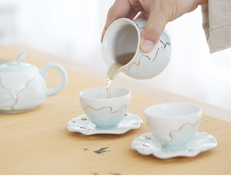 An Inset jades celadon tea set ceramic tea wash to contracted household kung fu tea cups cup mat of a complete set of gift boxes
