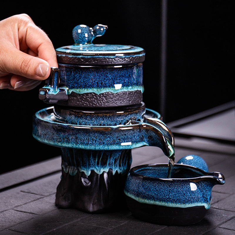 Ya xin $# up tea set home lazy semi - automatic creative stone mill kung fu tea, building ceramic lamp