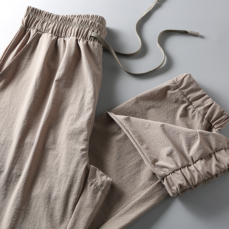 Laser Punch Holes Breathable Full Summer New Light Weight Quick Dry Bunch Stomp Pants Men Casual Pants Long Pants Tide