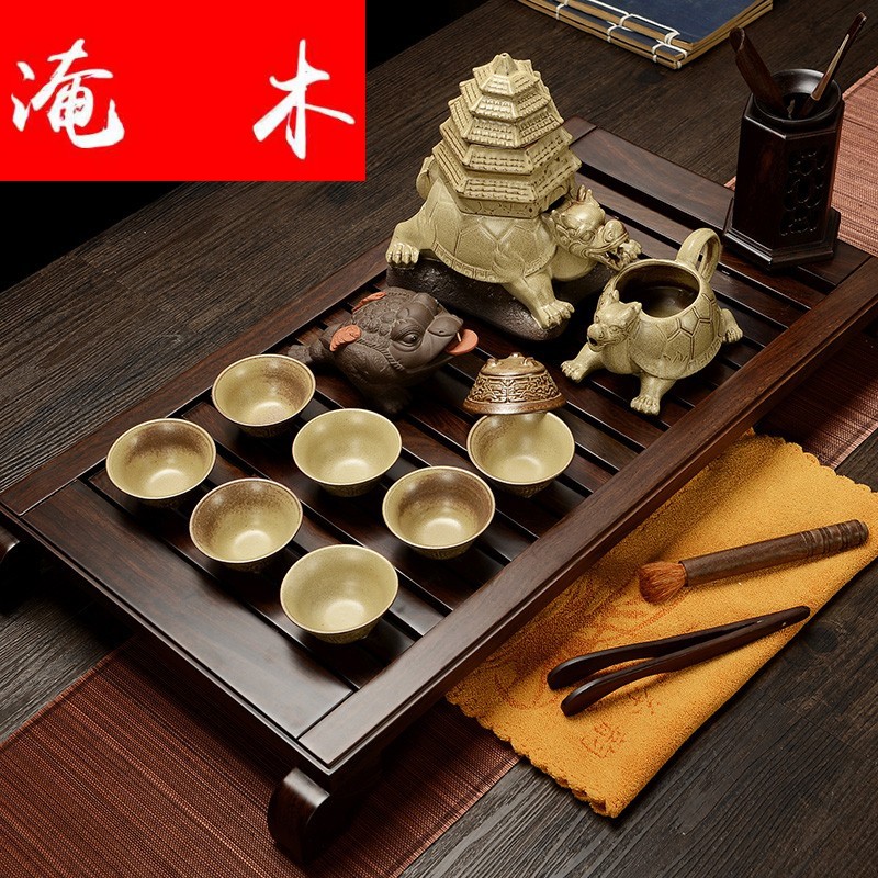 Flooded purple sand pottery and porcelain of a complete set of household solid wood ebony wood tea tray was Chinese tea tea art kung fu tea set