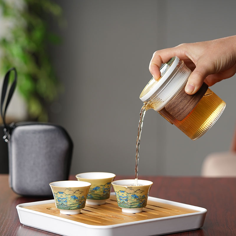 Lin Xiaowei crack cup against a pot of three cups of hot ceramics glass portable travel kung fu tea set contracted