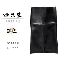 Черная сумка для ножниц с четырьмя предметами на веревке.