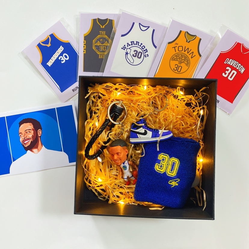 Curry hands on birthday present Warriors basketball perimeter Clay Thompson memorabilia models paparazzi puppets