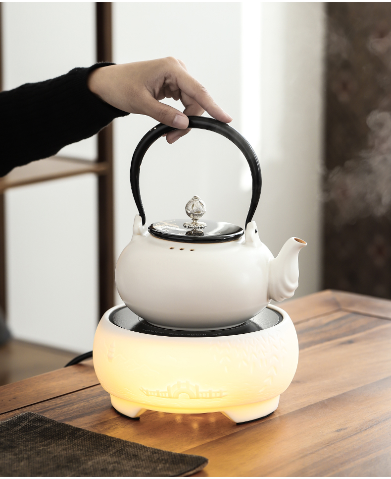 By mud household electrical TaoLu suet jade pervious to light white porcelain teapot tea boiled tea kettle furnace Japanese white pottery girder