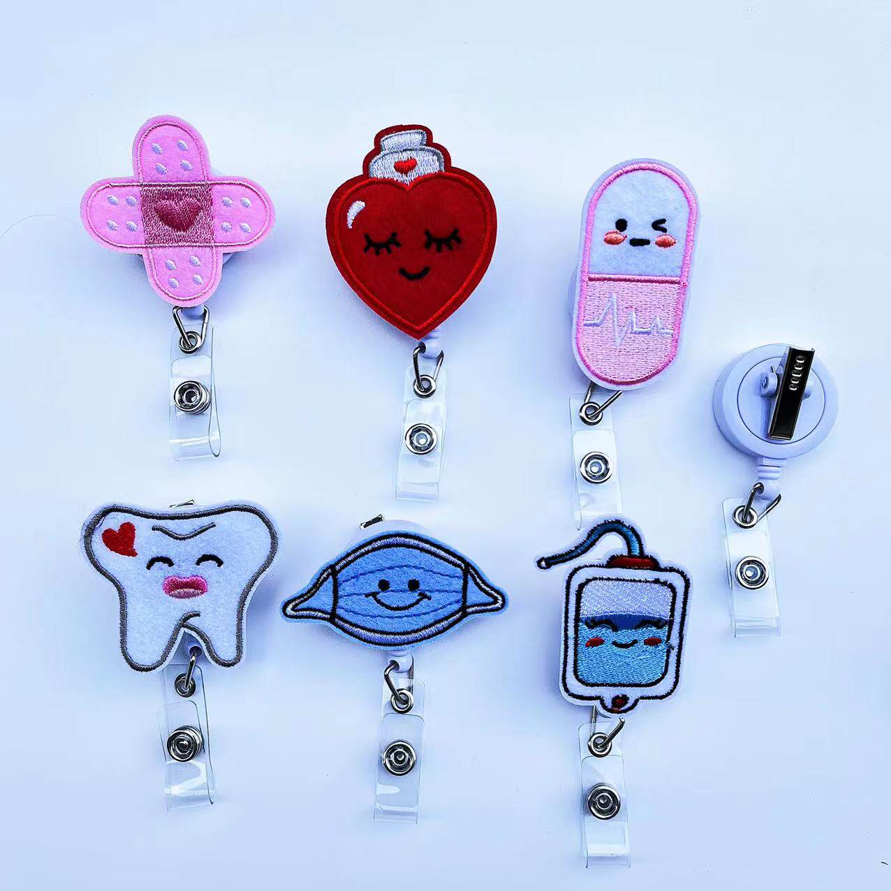 Cartoon medical rotate easy-pull button badge holder: healing nurse ...