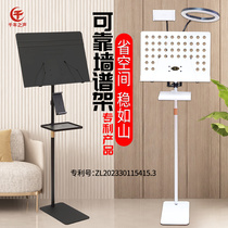 Millennium Voices patented guzheng music stand is placed against the wall and does not take up space. The dulcimer music stand is placed against the wall to save space and is used for sitting and playing the piano.