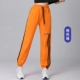 Апельсиновые ленточные брюки